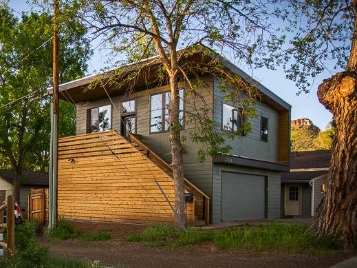 Two-story detached ADU with garage below and cedar siding